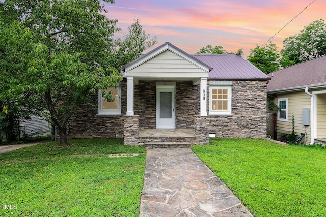 919 Chester St, Durham, NC 27701 - view of front of property with stone siding, a lawn, a porch, and a metal roof