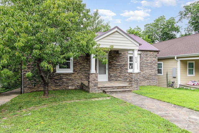919 Chester St, Durham, NC 27701 - view of front of house with stone siding, a front yard, and a porch