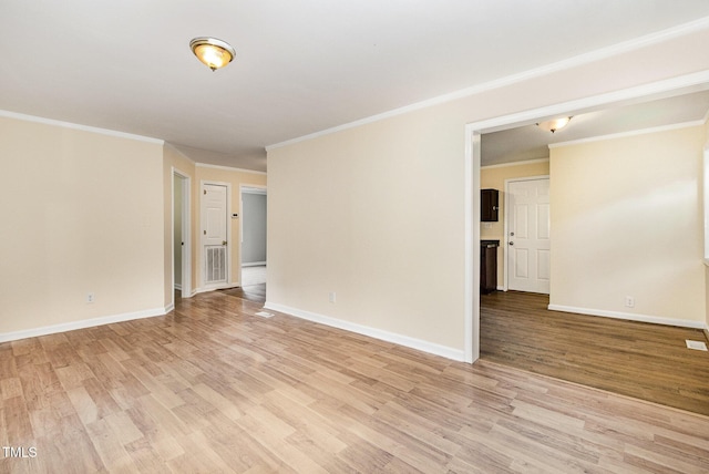 919 Chester St, Durham, NC 27701 - empty room with light wood-style floors and crown molding
