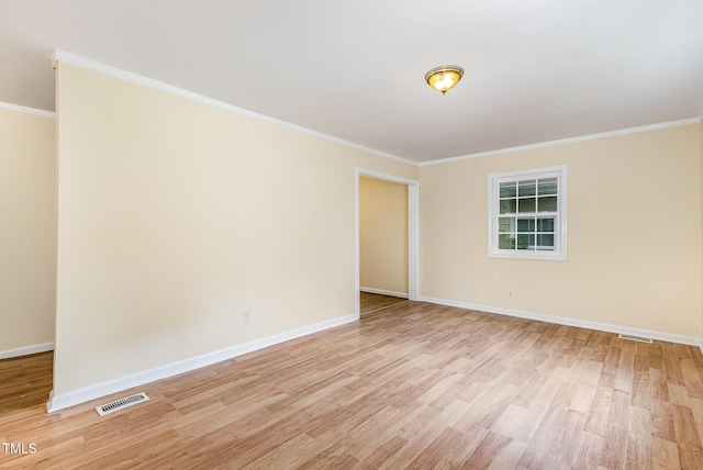 919 Chester St, Durham, NC 27701 - empty room featuring light wood-style flooring and crown molding