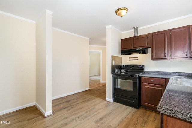 919 Chester St, Durham, NC 27701 - kitchen with black electric range, under cabinet range hood, dark countertops, light wood-style floors, and crown molding