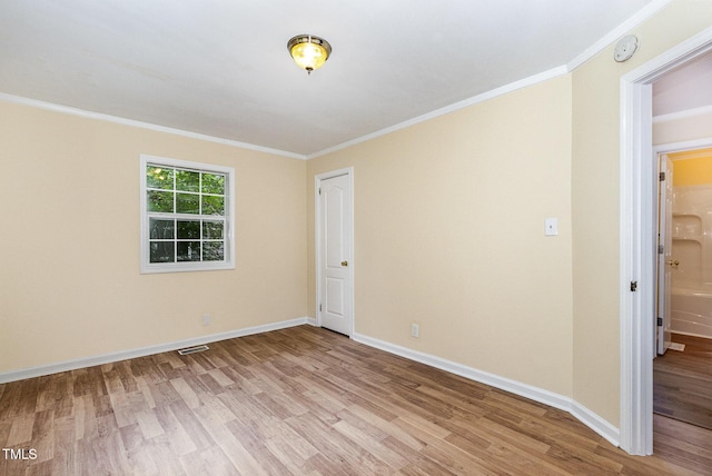 919 Chester St, Durham, NC 27701 - unfurnished room with light wood finished floors, ornamental molding, and a smoke detector