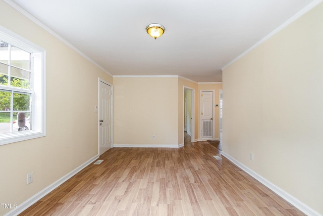 919 Chester St, Durham, NC 27701 - empty room with light wood-style flooring and ornamental molding