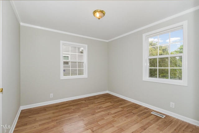919 Chester St, Durham, NC 27701 - empty room featuring light wood-style floors and ornamental molding