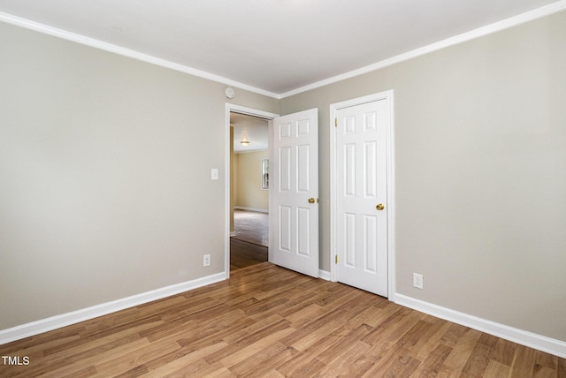 919 Chester St, Durham, NC 27701 - unfurnished bedroom featuring light wood finished floors and crown molding