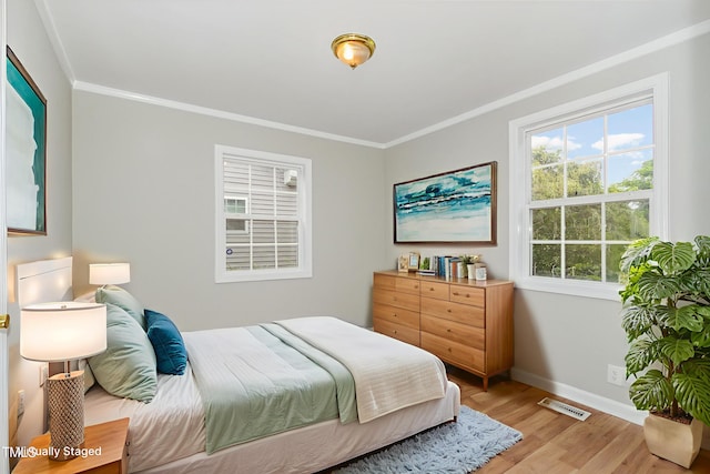 919 Chester St, Durham, NC 27701 - bedroom featuring ornamental molding and light wood-style flooring