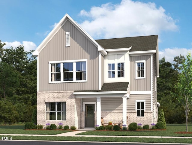2886 Quarry Rd Unit 161, Rolesville, NC 27571 - view of front of property featuring a shingled roof, board and batten siding, a front yard, and brick siding