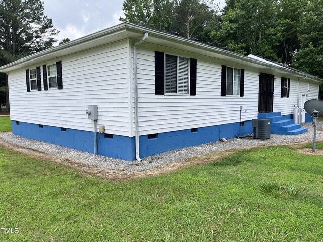 469 Whitehead Rd, Enfield, NC 27823 - view of side of home with crawl space, a lawn, and entry steps