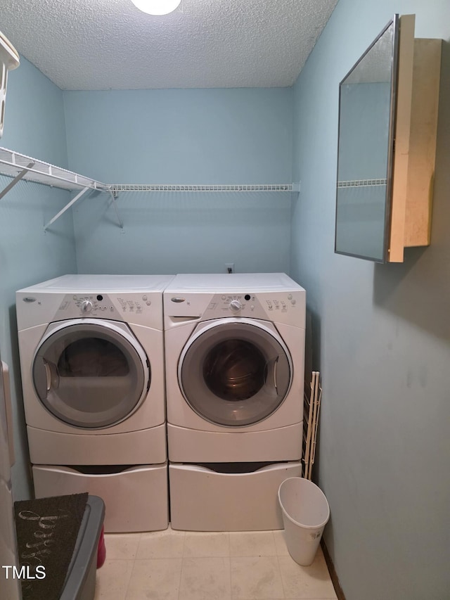 469 Whitehead Rd, Enfield, NC 27823 - washroom with washer and dryer and a textured ceiling