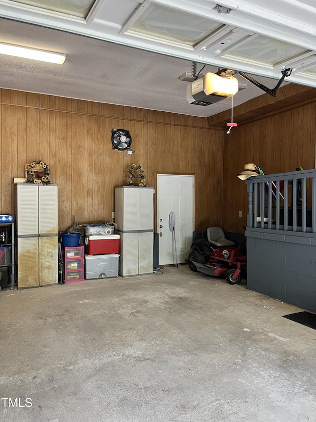 469 Whitehead Rd, Enfield, NC 27823 - garage featuring wooden walls and a garage door opener