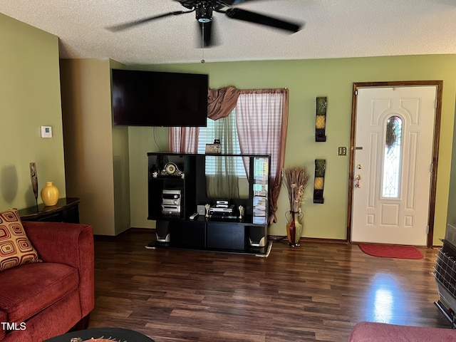 469 Whitehead Rd, Enfield, NC 27823 - living room featuring dark wood-style flooring, ceiling fan, healthy amount of natural light, and a textured ceiling