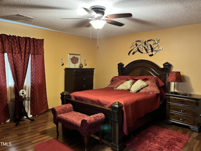 469 Whitehead Rd, Enfield, NC 27823 - bedroom featuring dark wood finished floors, a textured ceiling, and ceiling fan