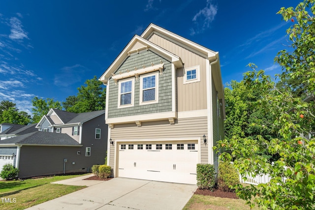 304 Garden Walk Dr, Durham, NC 27703 - view of front of property featuring a garage, driveway, and board and batten siding