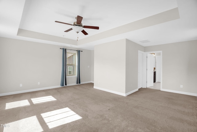 304 Garden Walk Dr, Durham, NC 27703 - spare room featuring carpet, ceiling fan, and a raised ceiling