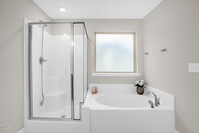 304 Garden Walk Dr, Durham, NC 27703 - bathroom with a shower stall and a bath