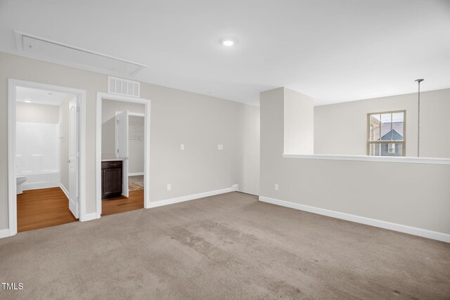 304 Garden Walk Dr, Durham, NC 27703 - carpeted empty room featuring attic access and baseboards