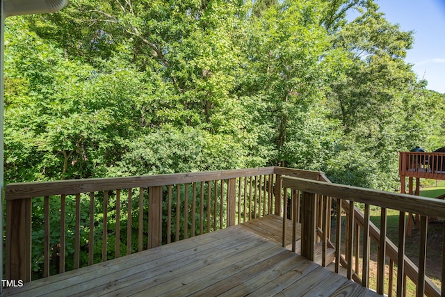304 Garden Walk Dr, Durham, NC 27703 - wooden deck with a wooded view