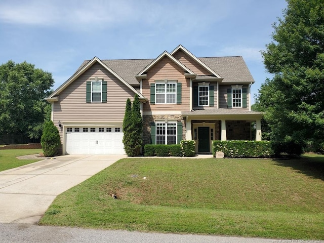 5724 Avera Ln, Holly Springs, NC 27540 - view of front of home with an attached garage, concrete driveway, stone siding, a front lawn, and a shingled roof
