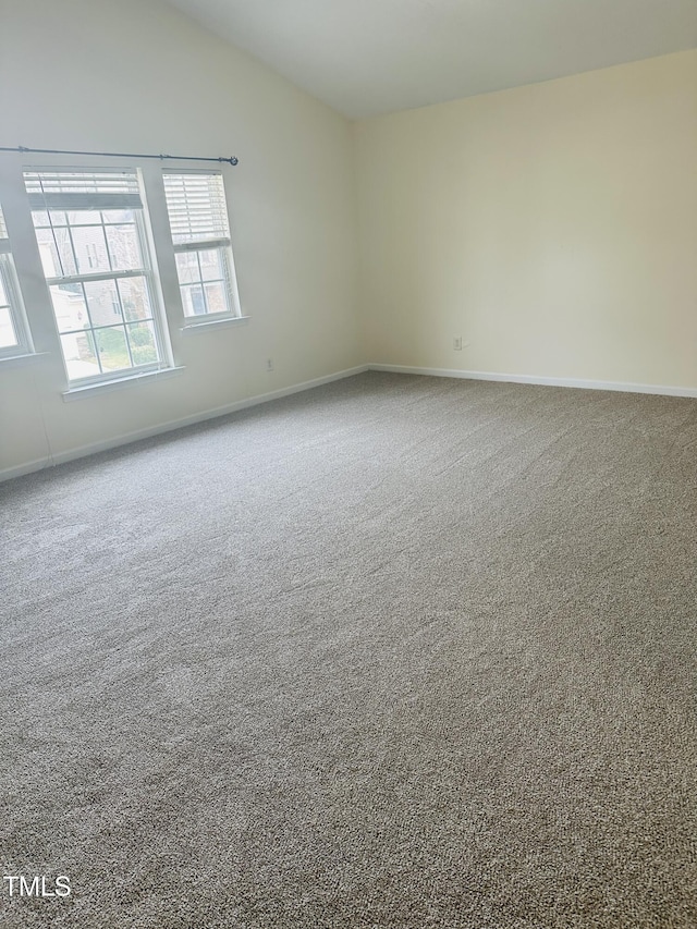 1150 Brookhill Way, Cary, NC 27519 - unfurnished room featuring carpet flooring and vaulted ceiling