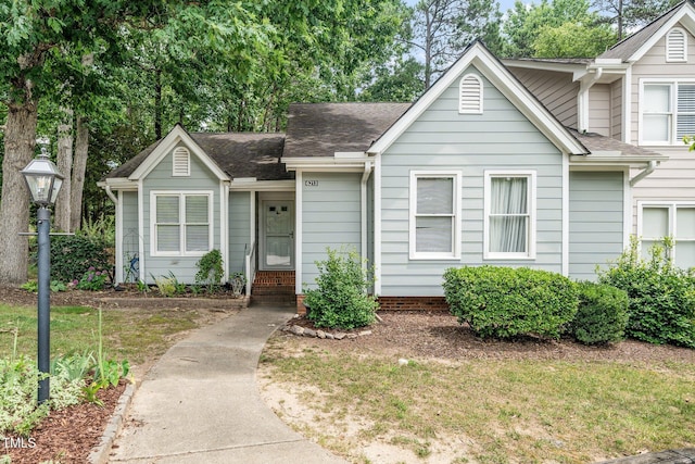 6213 Fountainhead Dr, Raleigh, NC 27609 - view of front of house featuring roof with shingles