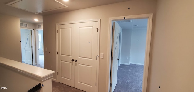 1426 Rosepine Dr, Cary, NC 27519 - hallway with attic access and dark colored carpet