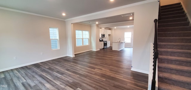 1426 Rosepine Dr, Cary, NC 27519 - unfurnished living room featuring stairs, dark wood-style floors, crown molding, and recessed lighting