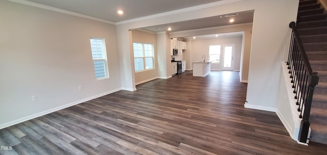 1426 Rosepine Dr, Cary, NC 27519 - unfurnished living room with stairway, ornamental molding, dark wood-style floors, and recessed lighting