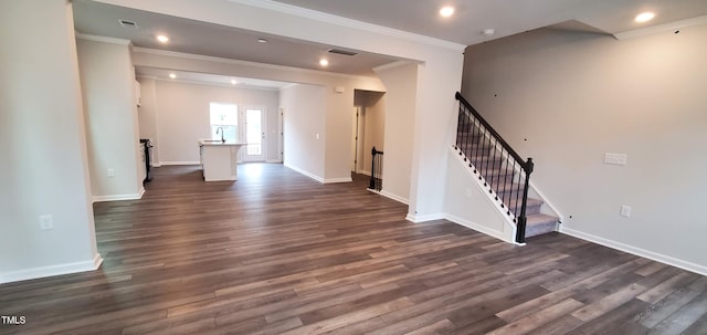 1426 Rosepine Dr, Cary, NC 27519 - unfurnished living room featuring dark wood-style flooring, crown molding, stairs, and recessed lighting