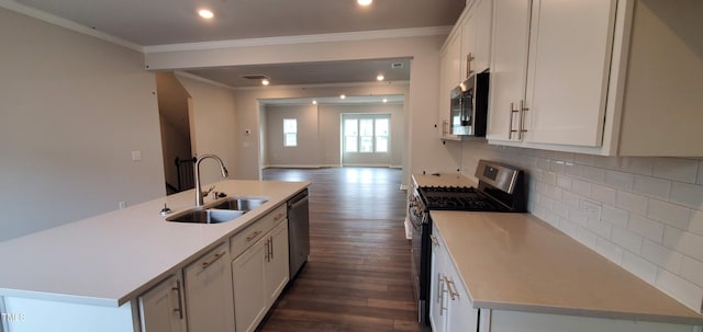 1426 Rosepine Dr, Cary, NC 27519 - kitchen with stainless steel appliances, open floor plan, crown molding, dark wood-style floors, and white cabinetry