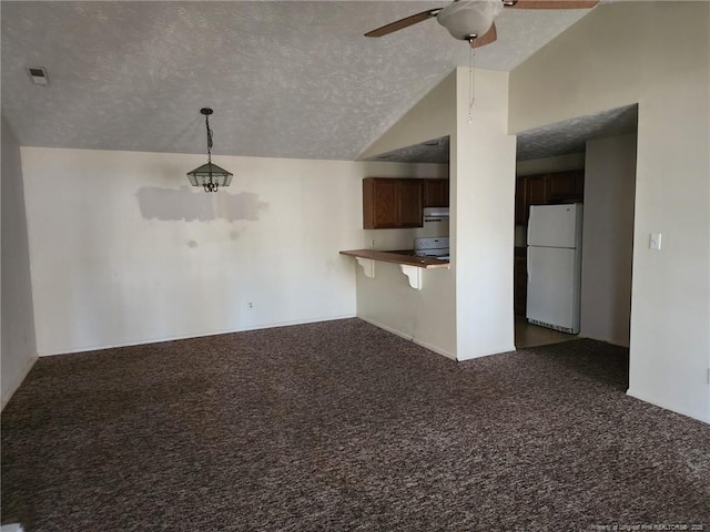 1900 Tryon Dr Unit 6, Fayetteville, NC 28303 - unfurnished living room with carpet flooring, a textured ceiling, lofted ceiling, and ceiling fan
