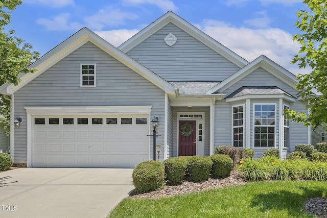 400 Indian Elm Ln, Cary, NC 27519 - view of front facade with driveway, a shingled roof, and an attached garage