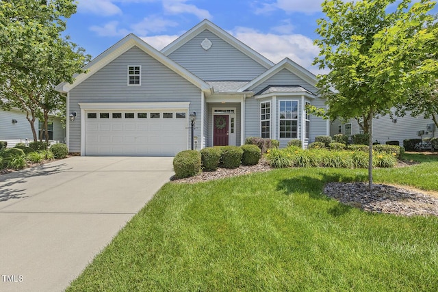400 Indian Elm Ln, Cary, NC 27519 - view of front of home featuring concrete driveway, a garage, and a front lawn