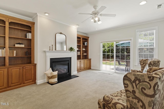 400 Indian Elm Ln, Cary, NC 27519 - living area featuring light carpet, a fireplace with flush hearth, crown molding, ceiling fan, and recessed lighting