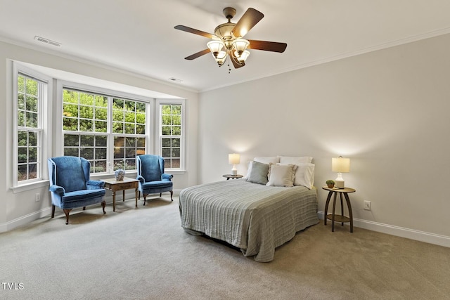 400 Indian Elm Ln, Cary, NC 27519 - carpeted bedroom with ornamental molding, multiple windows, and a ceiling fan
