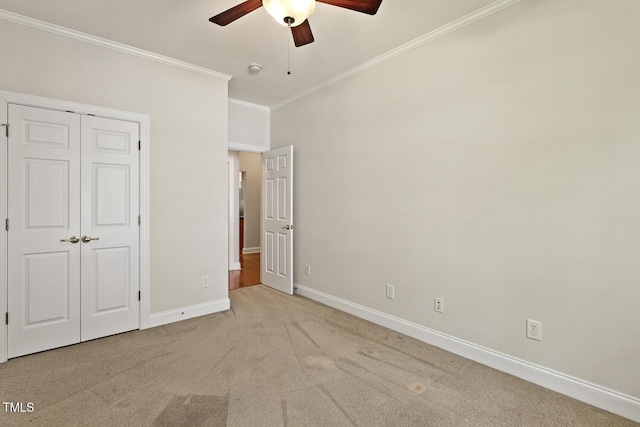 400 Indian Elm Ln, Cary, NC 27519 - unfurnished bedroom featuring crown molding, carpet flooring, a closet, and ceiling fan