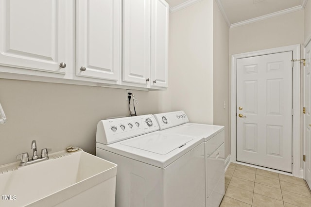 400 Indian Elm Ln, Cary, NC 27519 - laundry room featuring independent washer and dryer, ornamental molding, cabinet space, and light tile patterned floors