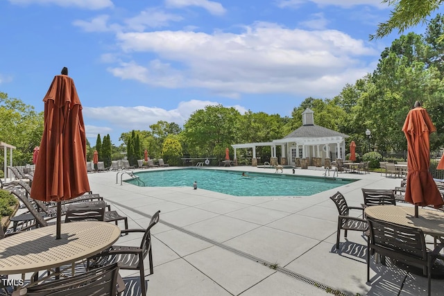 400 Indian Elm Ln, Cary, NC 27519 - community pool featuring a patio, view of wooded area, and a pergola