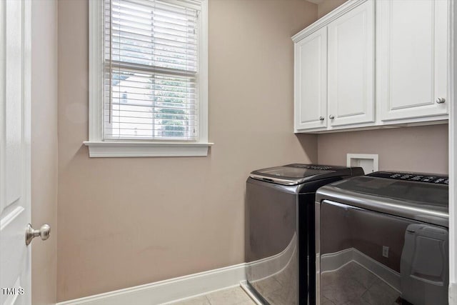10012 San Remo Pl, Wake Forest, NC 27587 - laundry room featuring independent washer and dryer, cabinet space, and tile patterned floors