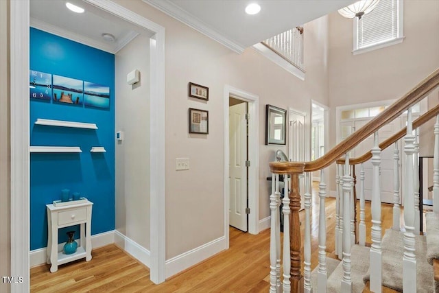 10012 San Remo Pl, Wake Forest, NC 27587 - foyer featuring ornamental molding, wood finished floors, and a towering ceiling