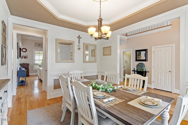 10012 San Remo Pl, Wake Forest, NC 27587 - dining area with a chandelier, light wood-style floors, and ornamental molding