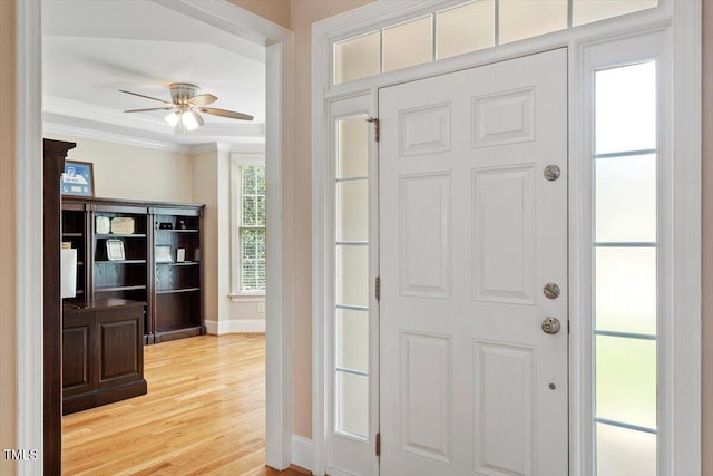 10012 San Remo Pl, Wake Forest, NC 27587 - entryway with ornamental molding, a ceiling fan, and light wood-type flooring