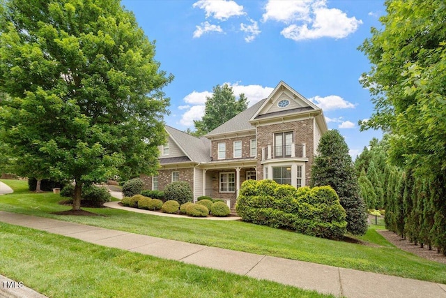 10012 San Remo Pl, Wake Forest, NC 27587 - view of front of property featuring brick siding and a front yard