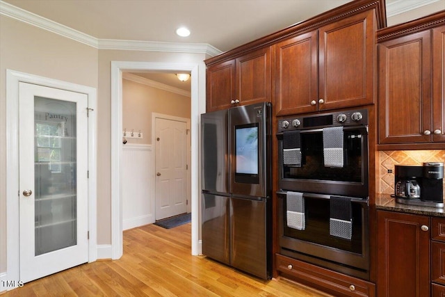 10012 San Remo Pl, Wake Forest, NC 27587 - kitchen with smart refrigerator, ornamental molding, light wood-style flooring, backsplash, and dark stone countertops