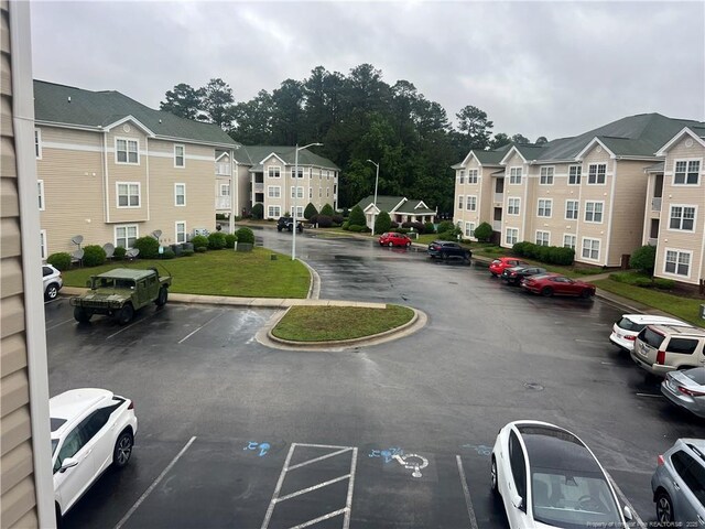 3322 Harbour Pointe Pl Unit 17, Fayetteville, NC 28314 - view of asphalt road with street lighting and curbs