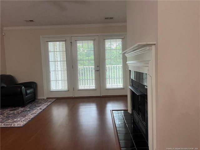 3322 Harbour Pointe Pl Unit 17, Fayetteville, NC 28314 - entryway with a tiled fireplace, wood finished floors, and crown molding