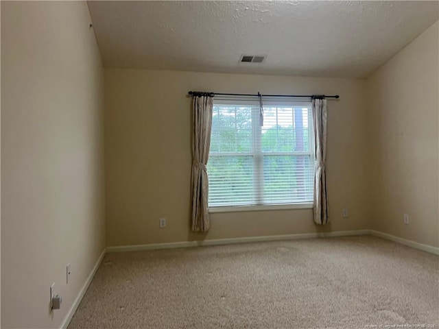 3322 Harbour Pointe Pl Unit 17, Fayetteville, NC 28314 - carpeted empty room featuring baseboards and a textured ceiling