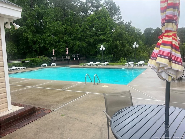 3322 Harbour Pointe Pl Unit 17, Fayetteville, NC 28314 - community pool with a patio and view of wooded area