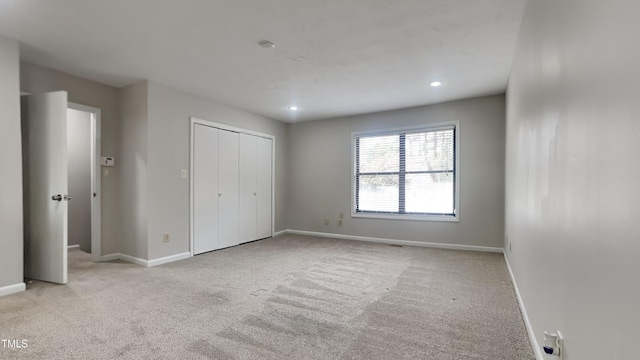933 Creek Side, Fayetteville, NC 28303 - unfurnished bedroom with carpet, a closet, and recessed lighting