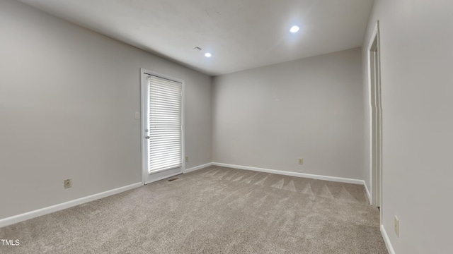 933 Creek Side, Fayetteville, NC 28303 - empty room featuring light colored carpet and recessed lighting