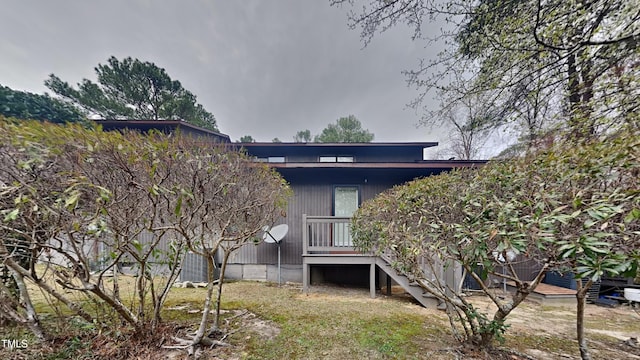 933 Creek Side, Fayetteville, NC 28303 - back of property featuring a wooden deck and stairway